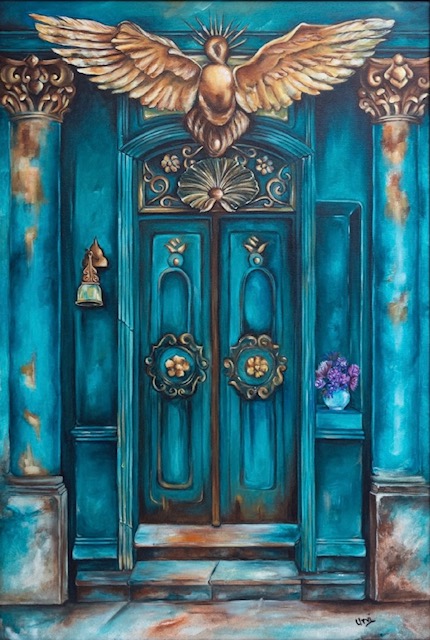 A turquoise doorway beneath a golden winged bird.